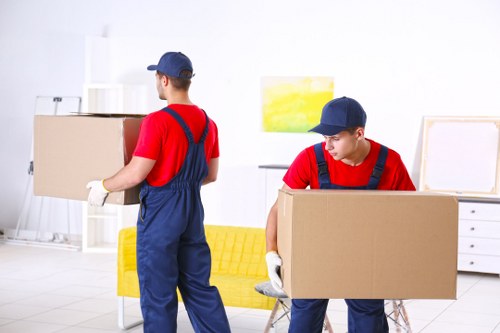 Team preparing moving equipment safely before a relocation job