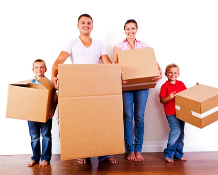 Moving van being loaded for a transparent price-based removal job
