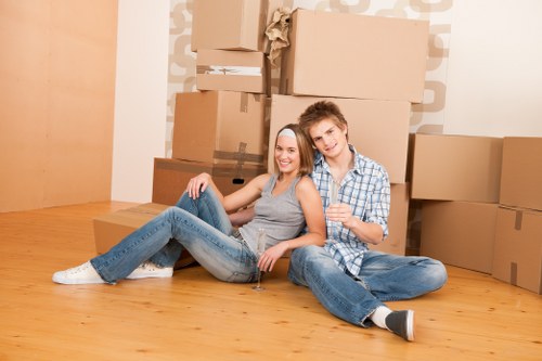 Moving truck in Maidavale loading household furniture for relocation