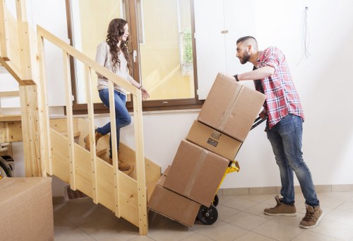 Moving team working safely with equipment and packed boxes