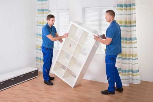 Team handling desks and files during an office move near Maida Vale