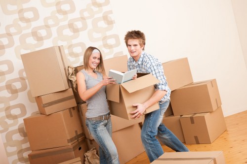 Worker assessing lifting conditions and handling risks during a move