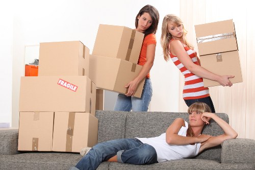 Removal team handling boxes and furniture during a Maidavale relocation